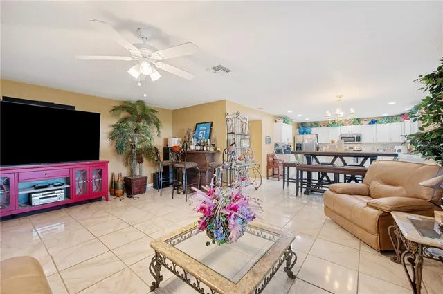 a kitchen with cabinets and chairs