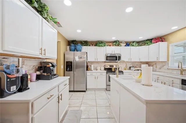 a view of kitchen with cabinets and wooden floor
