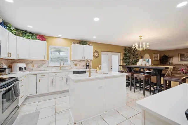a view of a livingroom with furniture and stairs