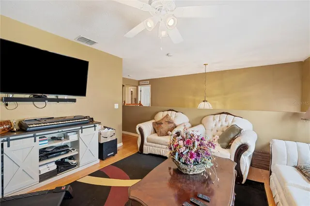 a living room with furniture and a rug