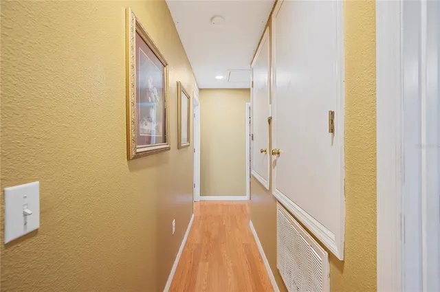 a bedroom with furniture and a flat screen tv