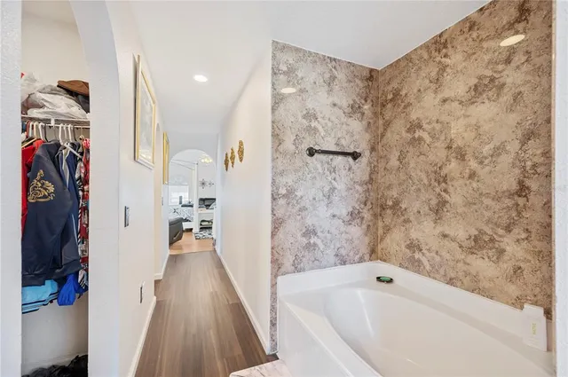 a bathroom with a sink a toilet and shower curtain