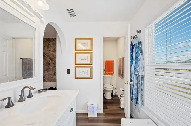 a bathroom with a shower and a toilet