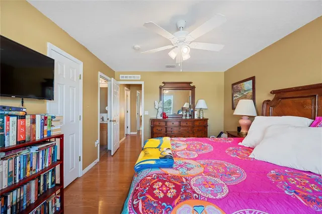 a bed room with a bed and a tv