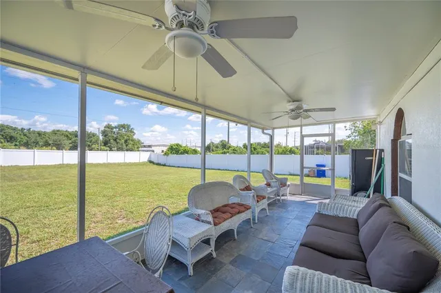 a view of a house with a backyard and porch