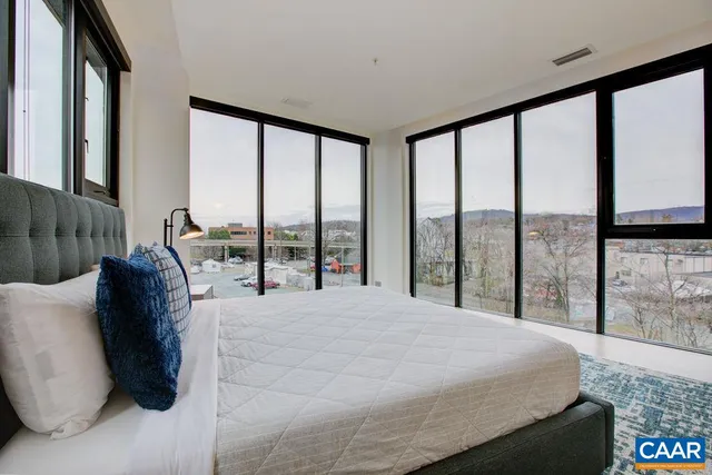 a view of a kitchen with wooden cabinet