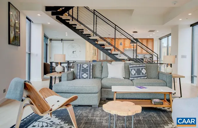 a living room with furniture and a table