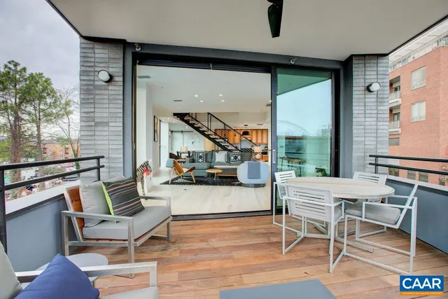 a outdoor space with lots of furniture and windows