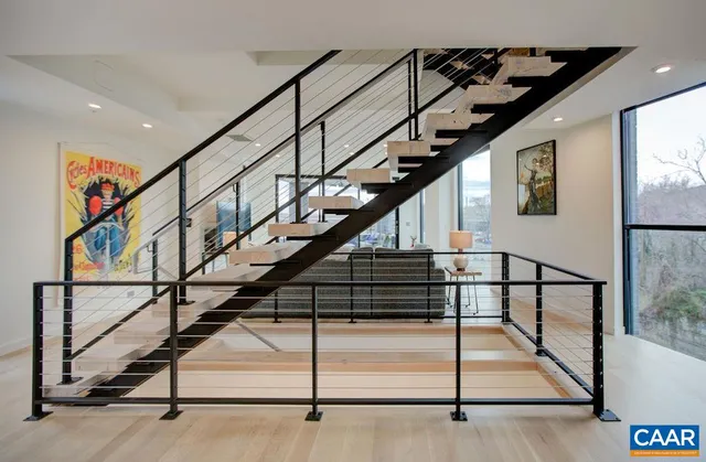 a kitchen with a sink a counter top space and windows
