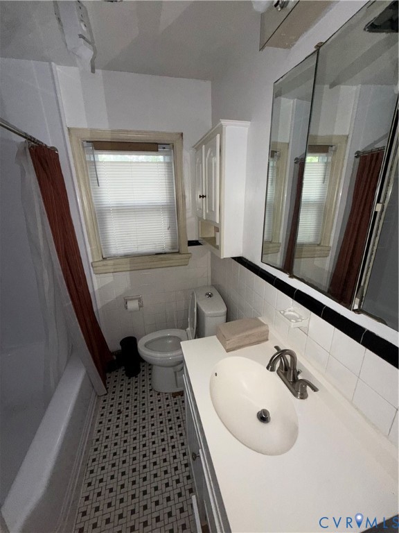 3605 Dill Road Richmond, VA 23222 - Photo 3 of 11 White vanity with an integrated sink and brushed n