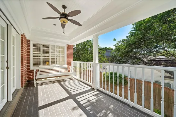 a view of a balcony with wooden floor