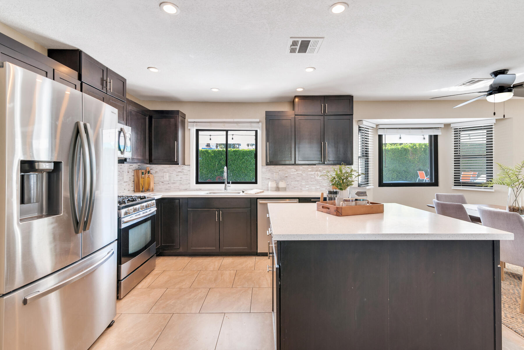 2003 North Sandra Road Palm Springs, CA 92262 - Photo 11 of 25 a kitchen with a sink and stainless steel appliances