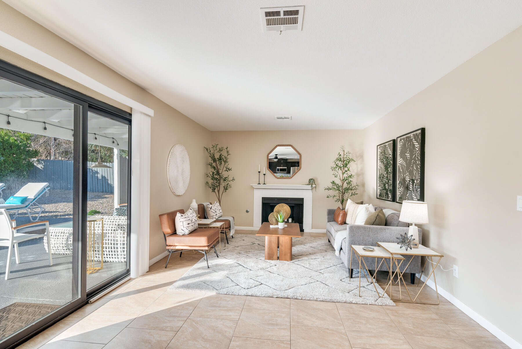 2003 North Sandra Road Palm Springs, CA 92262 - Photo 13 of 25 a living room with furniture a fireplace and a floor to ceiling window