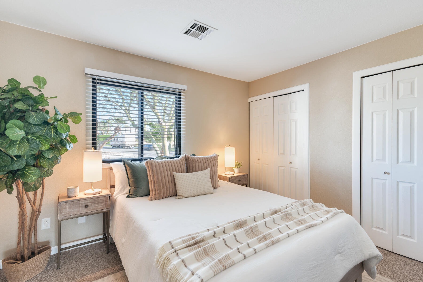 2003 North Sandra Road Palm Springs, CA 92262 - Photo 17 of 25 a bedroom with a large bed and a potted plant