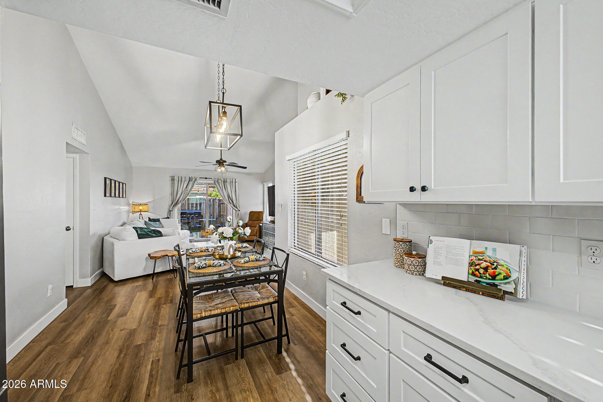 2455 East Broadway Road, Unit 65 Mesa, AZ 85204 - Photo 14 of 36 a kitchen view with wooden floor and stainless steel appliances