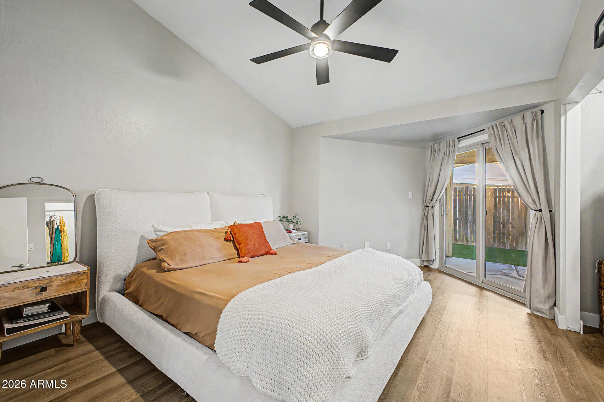 2455 East Broadway Road, Unit 65 Mesa, AZ 85204 - Photo 15 of 36 a bedroom with a bed and a large window