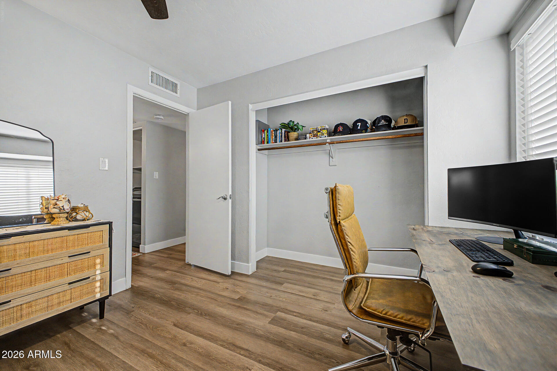 2455 East Broadway Road, Unit 65 Mesa, AZ 85204 - Photo 20 of 36 a workspace with furniture and wooden floor