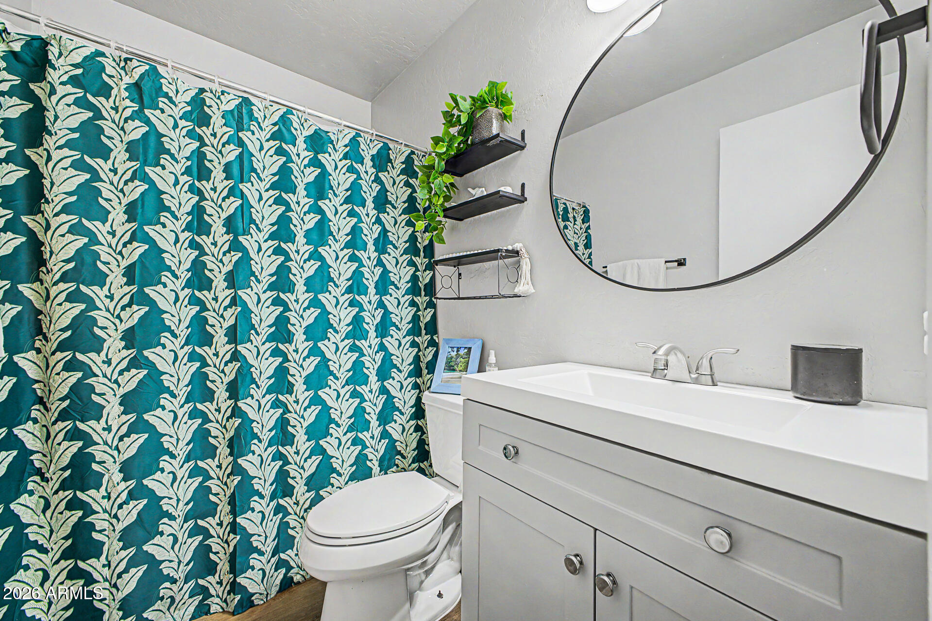 2455 East Broadway Road, Unit 65 Mesa, AZ 85204 - Photo 21 of 36 a bathroom with a sink and a mirror