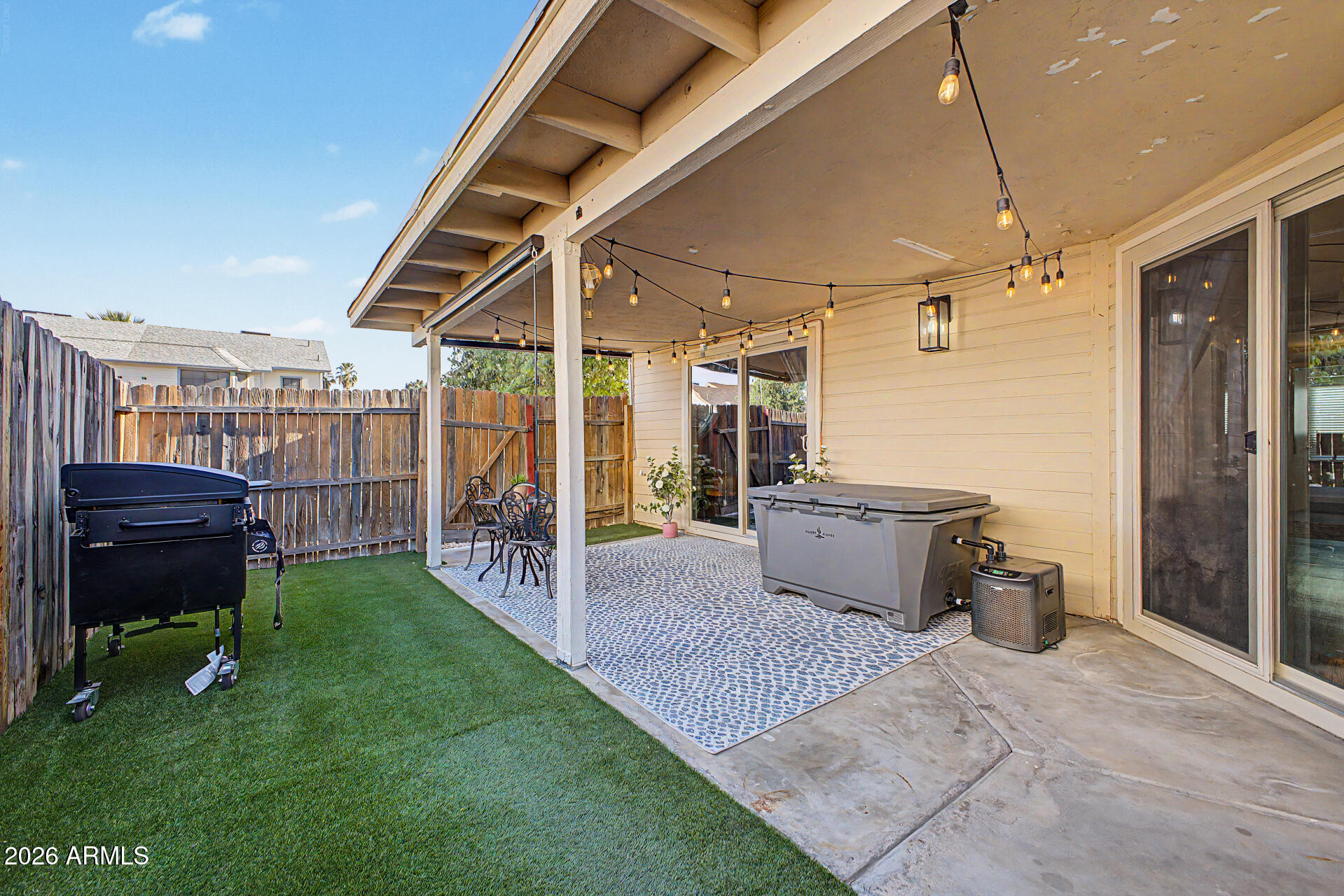 2455 East Broadway Road, Unit 65 Mesa, AZ 85204 - Photo 24 of 36 a view of a porch with furniture and a yard