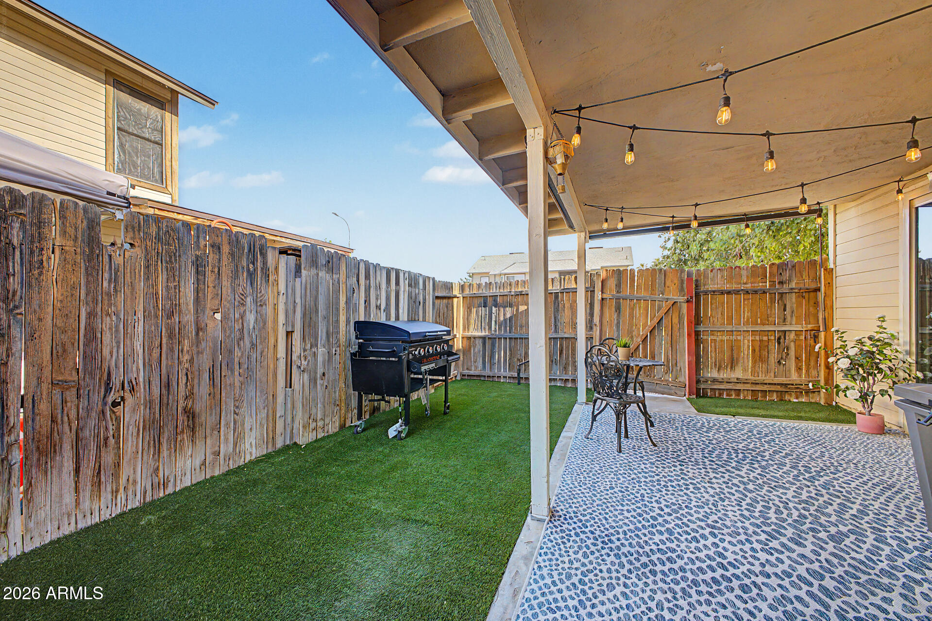 2455 East Broadway Road, Unit 65 Mesa, AZ 85204 - Photo 25 of 36 a view of a porch with chairs and backyard