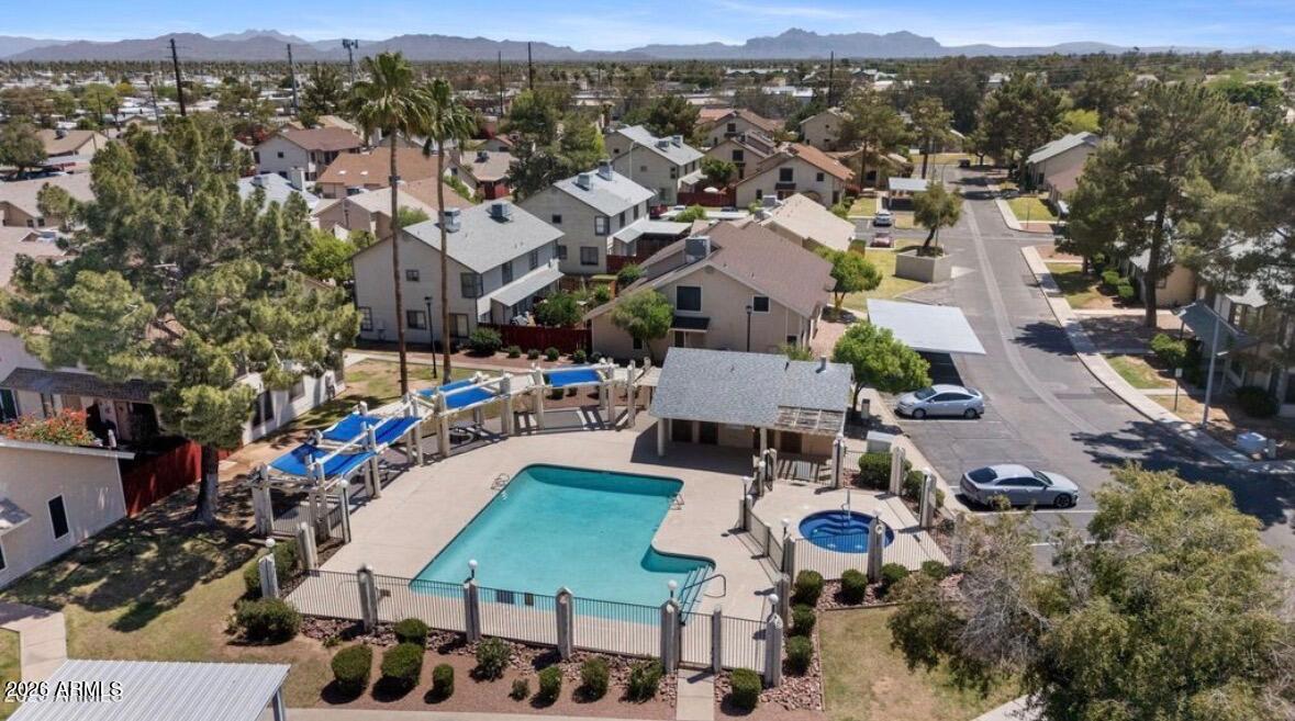 2455 East Broadway Road, Unit 65 Mesa, AZ 85204 - Photo 28 of 36 an aerial view of multiple houses with yard