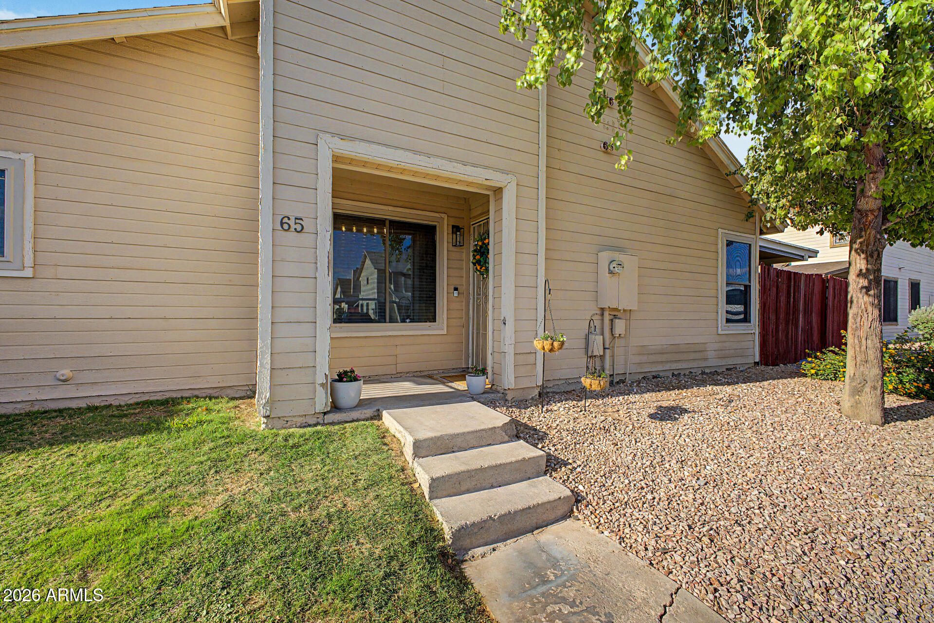 2455 East Broadway Road, Unit 65 Mesa, AZ 85204 - Photo 3 of 36 a front view of a house with garden