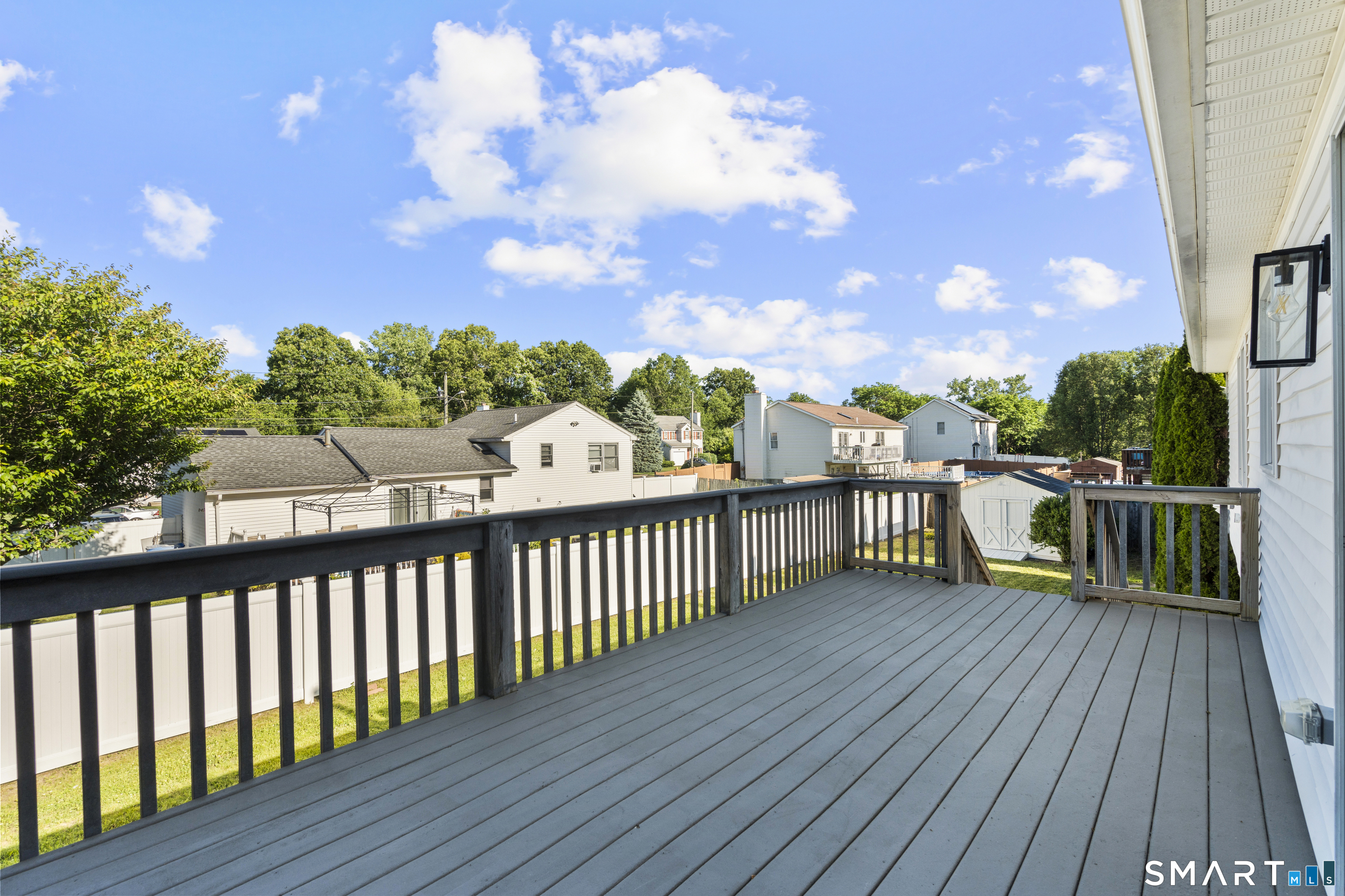 39 Joseph Lane Hamden, CT 06514 - Photo 8 of 40 a view of a balcony with wooden floor