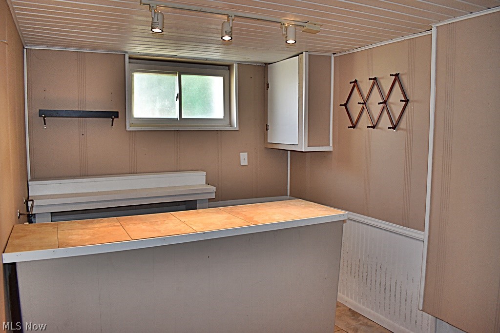 7715 Ackley Road Parma, OH 44129 - Photo 18 of 27 Basement wet bar with rail lighting