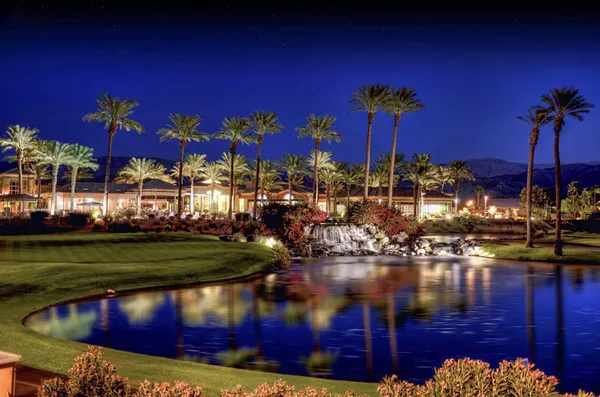 a view of a golf course with a big yard