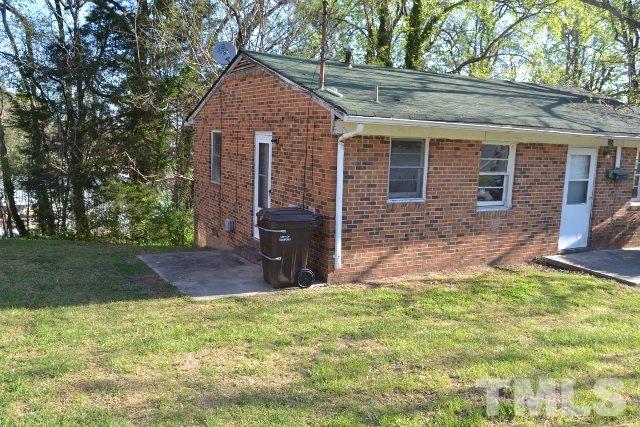 124 Harris Street Roxboro, NC 27573 - Photo 2 of 8 front view of house with a yard