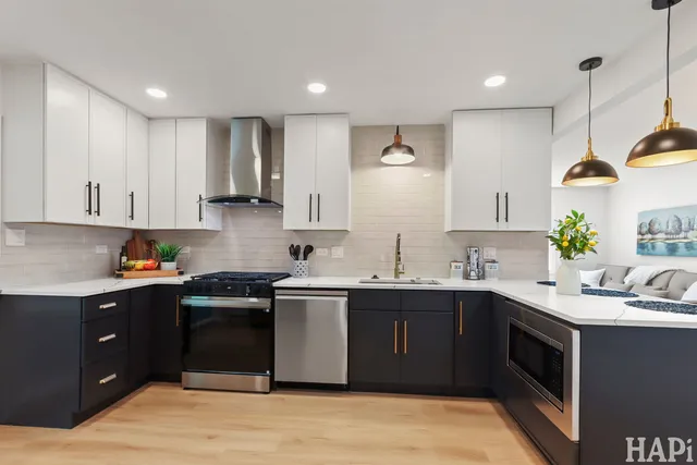 a kitchen with a sink and cabinets