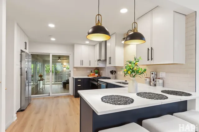 a kitchen with a table and chairs in it