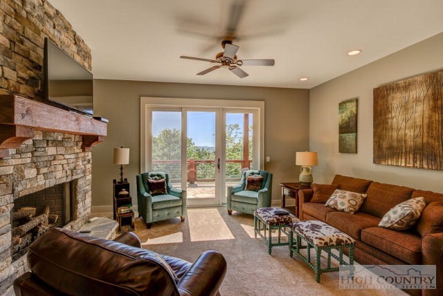14 Goldenrod Road Boone, NC 28607 - Photo 11 of 16 a living room with furniture a fireplace and a large window