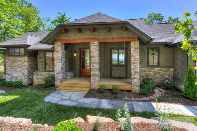 14 Goldenrod Road Boone, NC 28607 - Photo 4 of 16 a front view of a house with garden