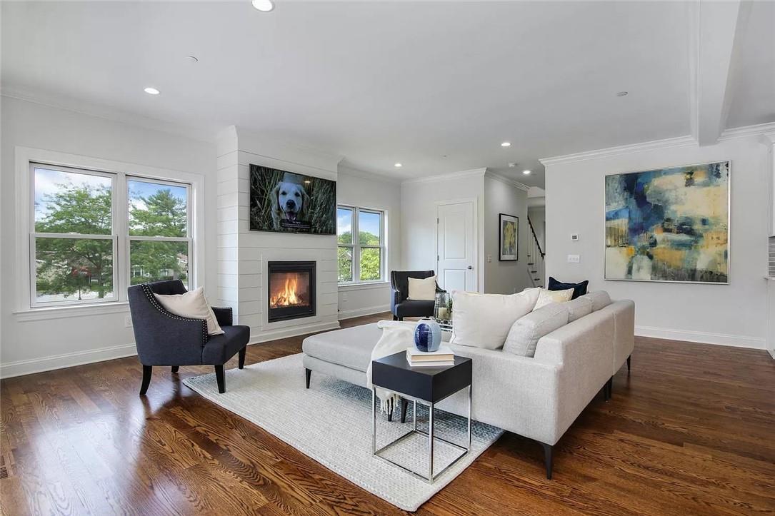 314 Boulder Ridge Road, Unit 36 South Salem, NY 10590 - Photo 1 of 1 Living room featuring beamed ceiling, ornamental molding, dark hardwood / wood flooring, and a fireplace