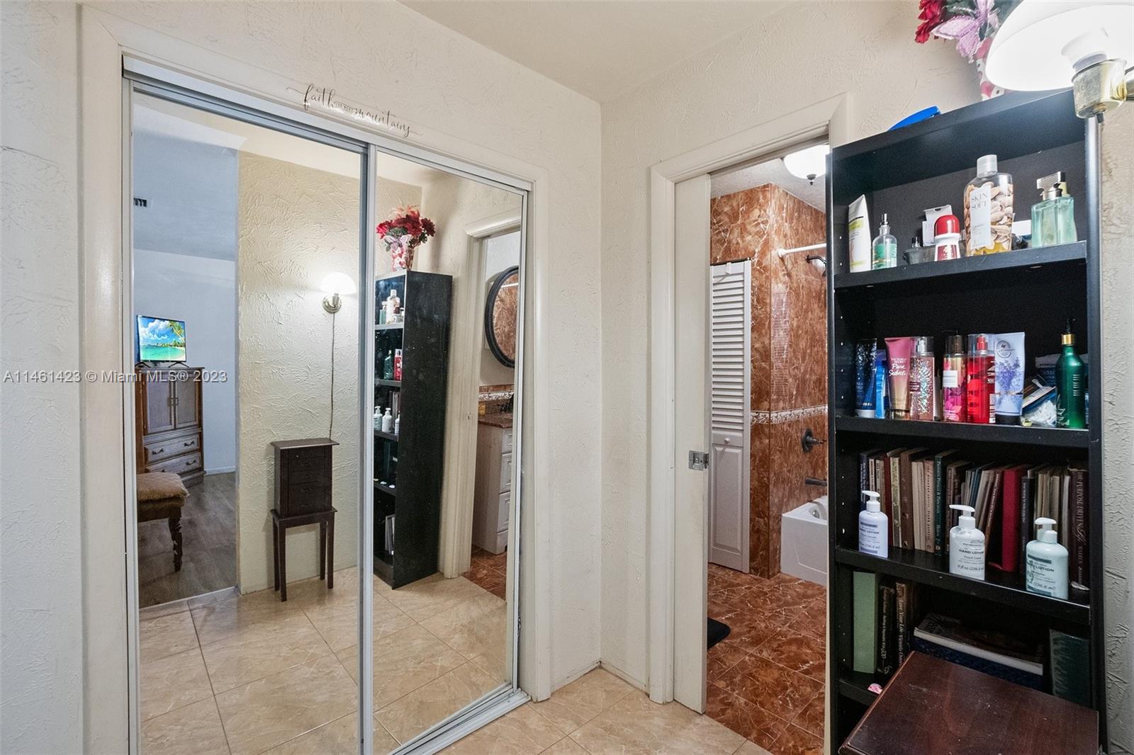 3405 East Shore Road Miramar, FL 33023 - Photo 16 of 25 a view of a livingroom with furniture and a flat screen tv