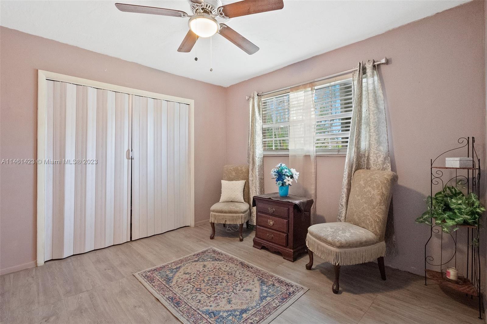3405 East Shore Road Miramar, FL 33023 - Photo 18 of 25 a living room with furniture and a potted plant