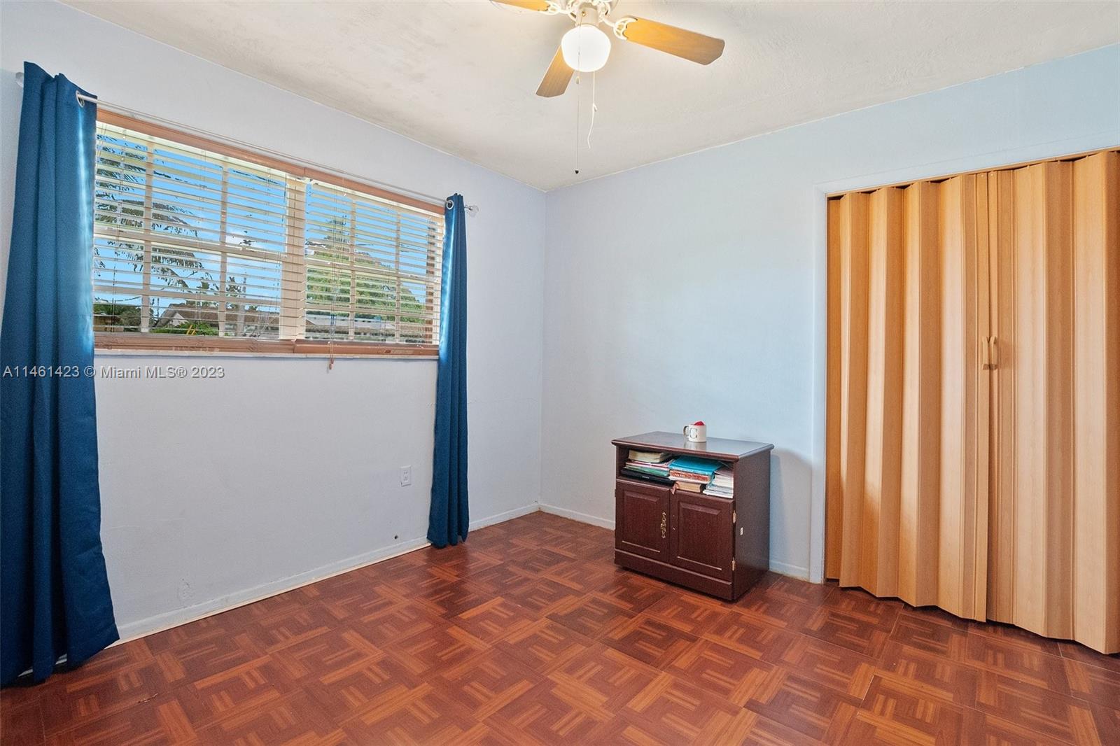 3405 East Shore Road Miramar, FL 33023 - Photo 21 of 25 a bedroom with a bed and a window