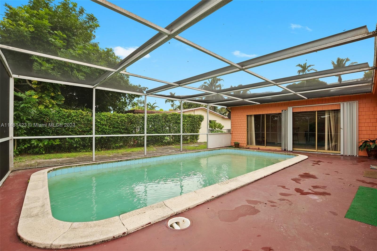 3405 East Shore Road Miramar, FL 33023 - Photo 24 of 25 a view of a backyard with a swimming pool