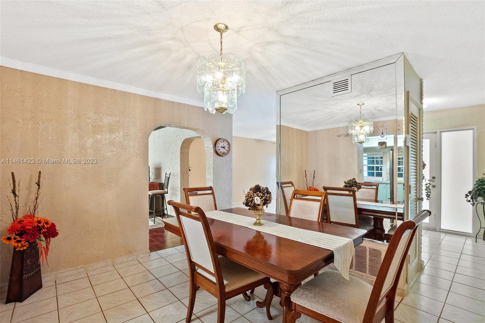 3405 East Shore Road Miramar, FL 33023 - Photo 6 of 25 a view of a dining room with furniture and chandelier