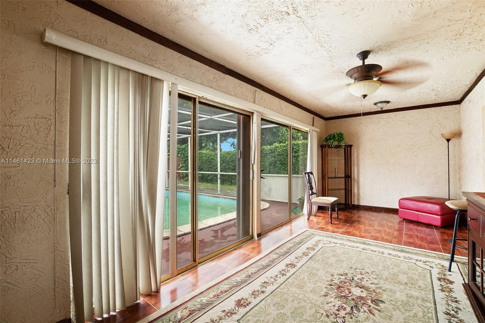 3405 East Shore Road Miramar, FL 33023 - Photo 7 of 25 a living room with furniture and a flat screen tv