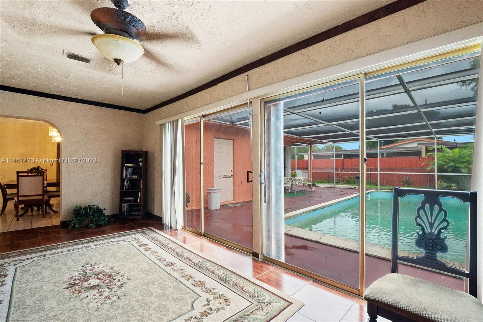 3405 East Shore Road Miramar, FL 33023 - Photo 9 of 25 a bedroom with furniture window and a rug