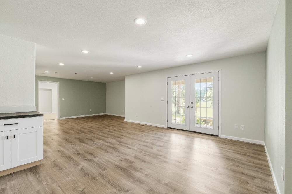 11756 Merganser Road Klamath Falls, OR 97601 - Photo 52 of 73 a view of an empty room with wooden floor and a window