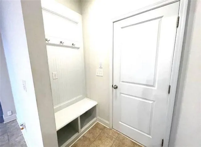 a bathroom with a shower and a sink