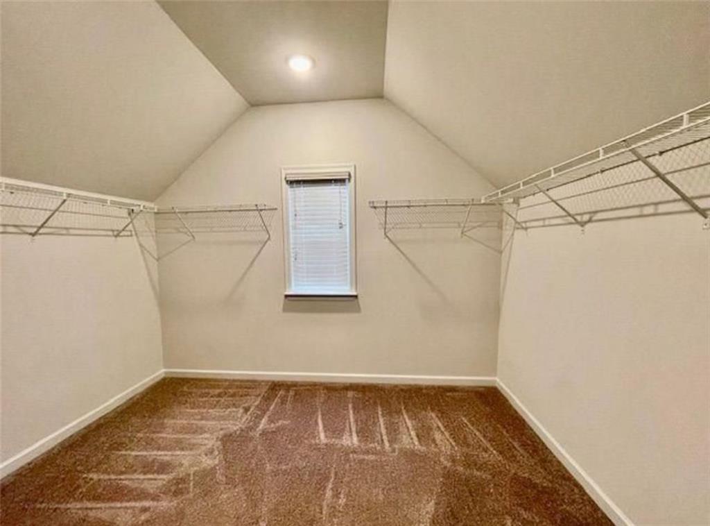 181 Charolais Drive McDonough, GA 30252 - Photo 22 of 25 a view of a room with racks on the wall