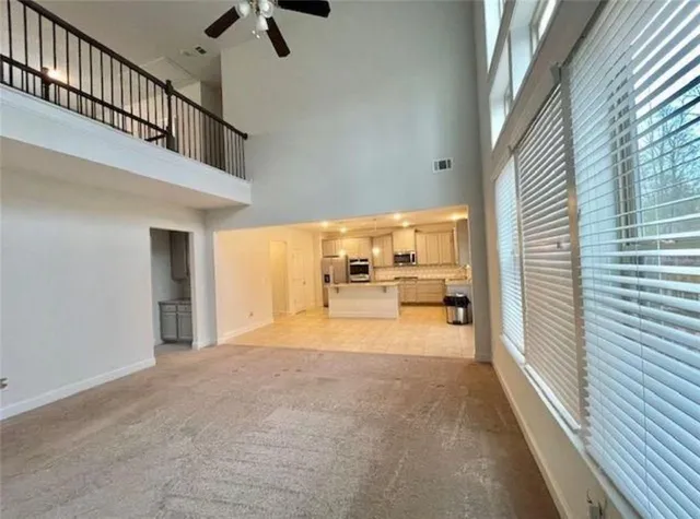 a view of a kitchen with a sink and cabinets