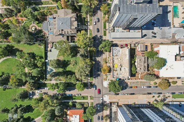 a view of street along with house and trees