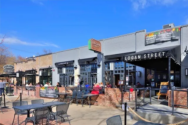 a view of a cafe with sitting area