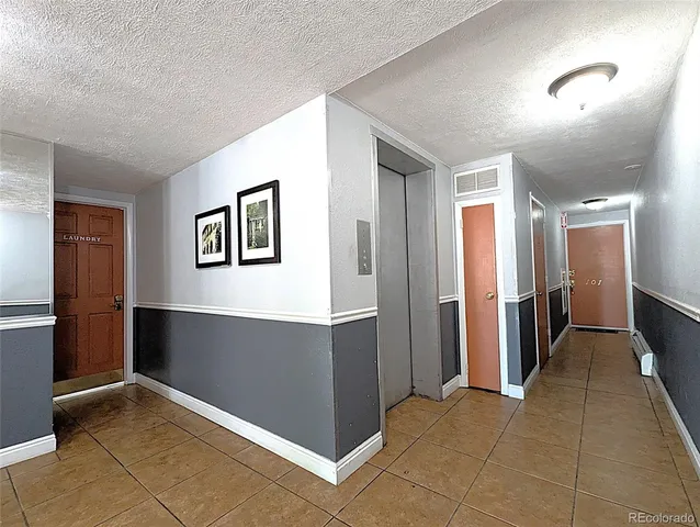 a view of a hallway with closet area