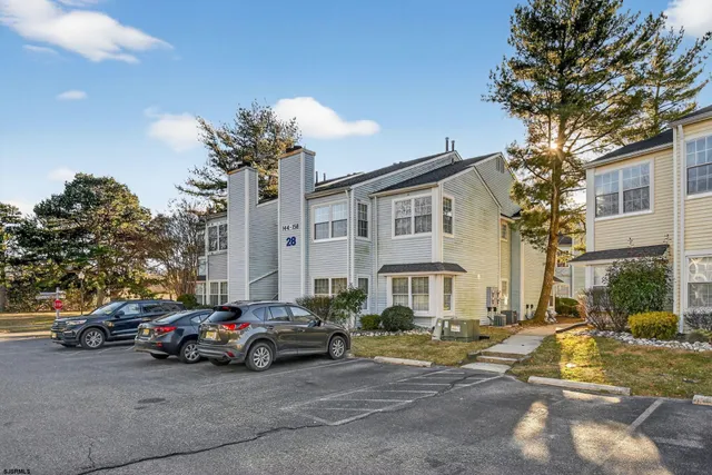a view of a cars in front of a house